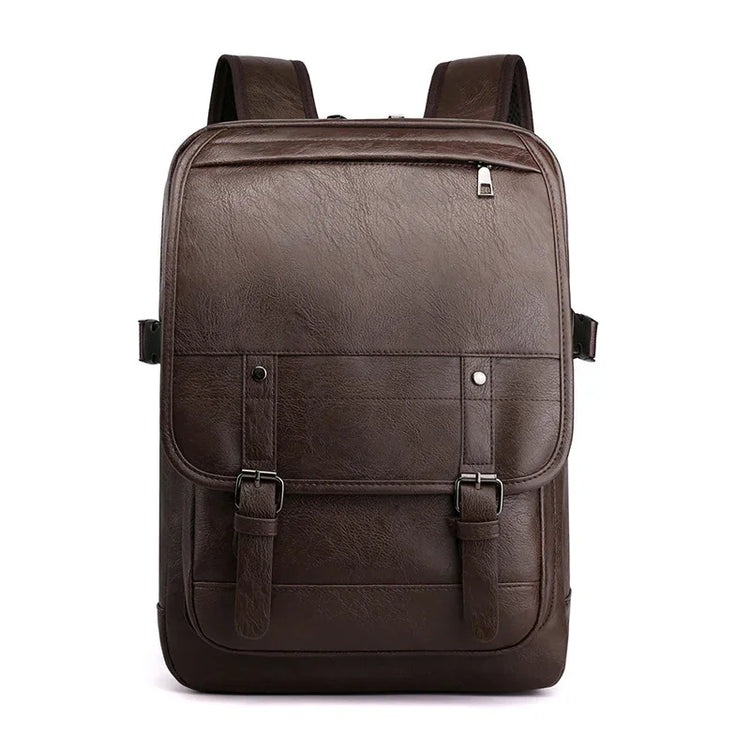 Brown faux leather backpack with front buckle straps, square shape, and minimalist design