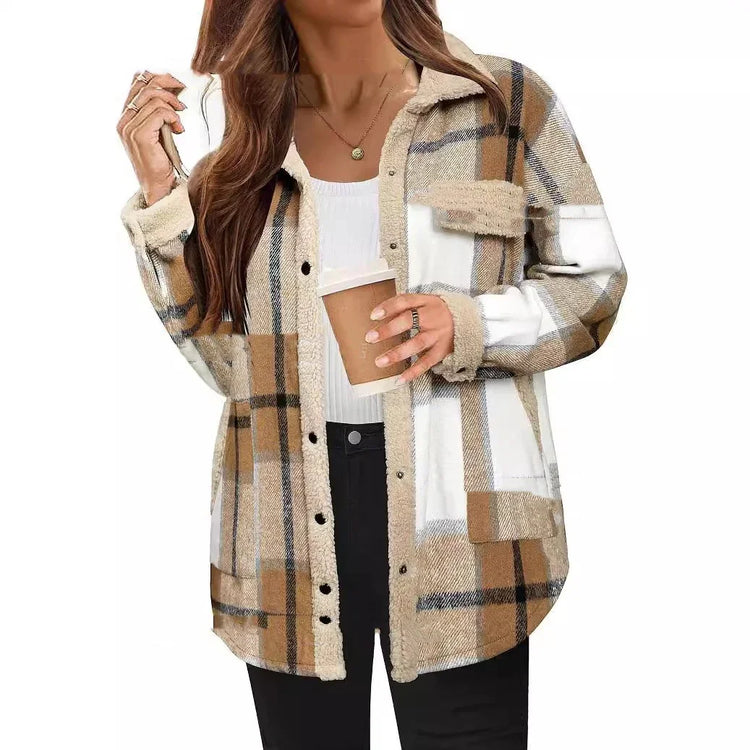 Woman wearing oversized beige and brown plaid fleece jacket, casual fit, with black pants.