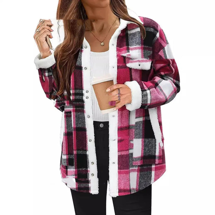 Woman wearing pink and black plaid sherpa fleece jacket with relaxed fit and white trim
