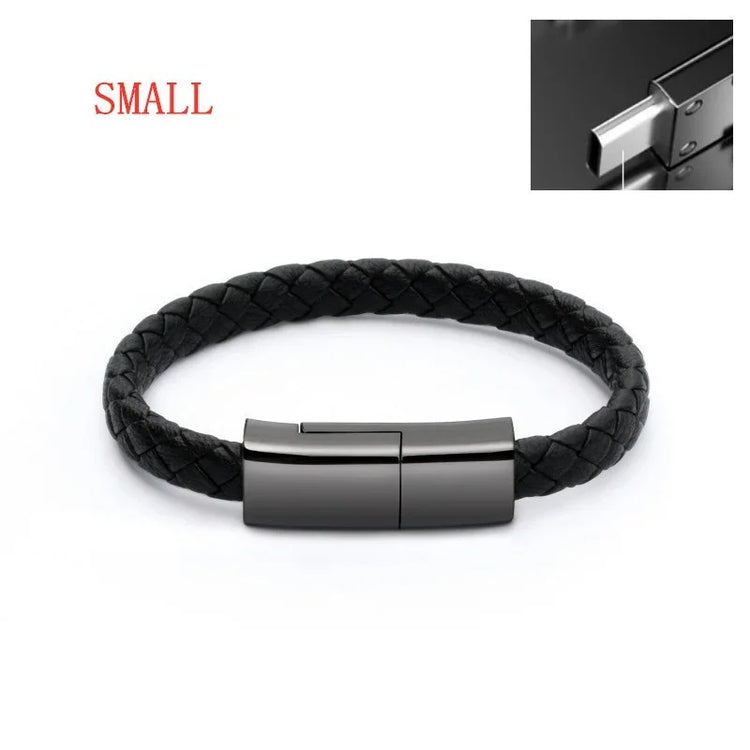 Small black braided leather bracelet with sleek metal clasp, modern minimalist style.