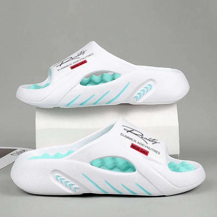 White slip-on foam slides with turquoise accents, open toe, sporty streetwear style, casual fit