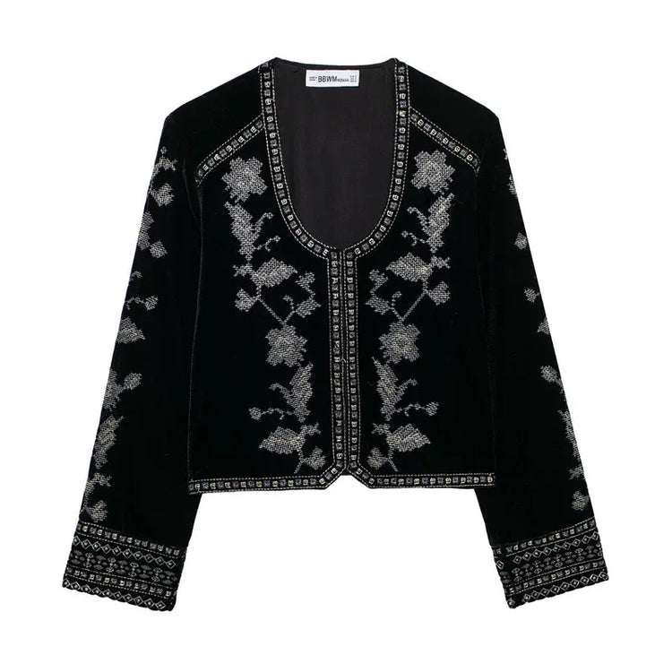 Black velvet jacket with silver floral embroidery, relaxed fit, long sleeves.