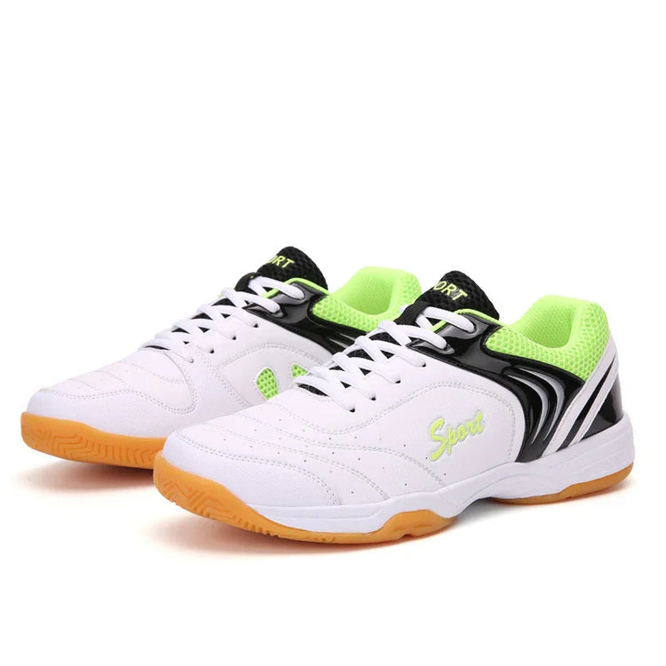 White and neon green athletic sneakers with mesh panels, black accents, and gum rubber sole