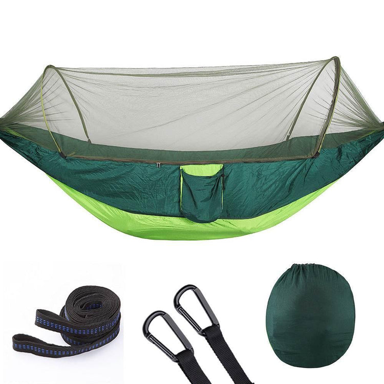 Green nylon camping hammock with mosquito net, straps, and carabiners included