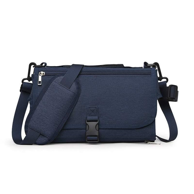 Navy blue crossbody messenger bag with adjustable strap, zipper and buckle closure, durable fabric