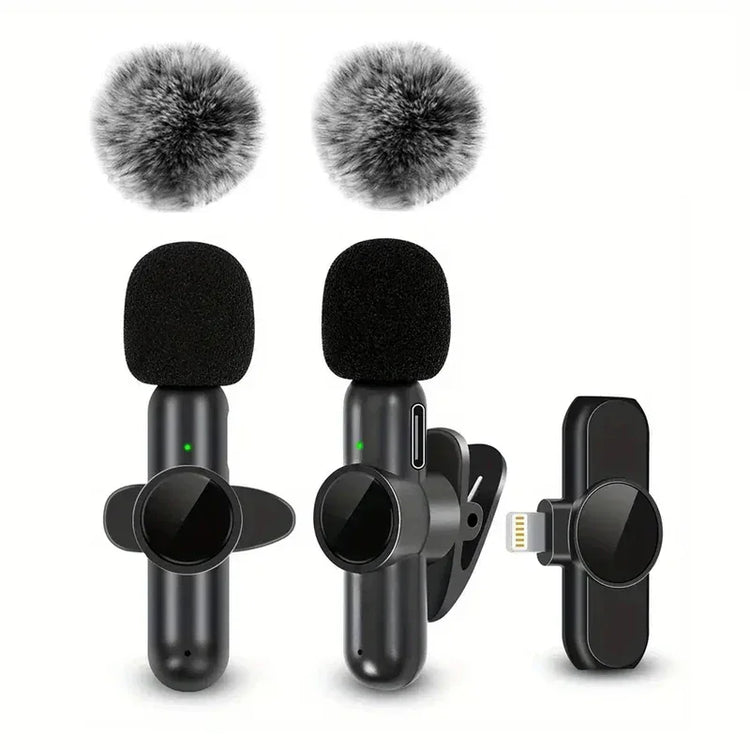 Black wireless clip-on microphones with foam windshields and a small receiver on white background