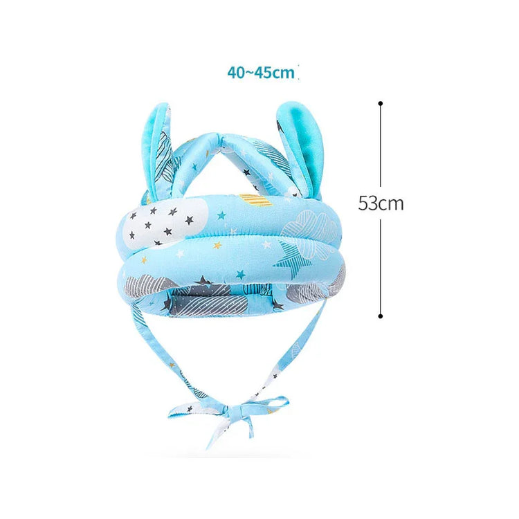 Blue baby safety helmet with cloud and star print, soft fabric, adjustable fit, ear details