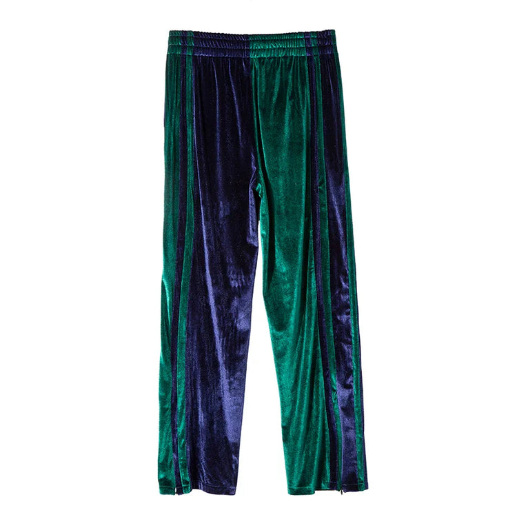 Green and navy blue velvet track pants with elastic waist and relaxed fit