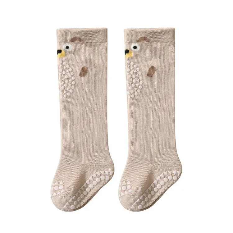 Beige knee-high socks with bear face design, non-slip soles, soft knit material, relaxed fit