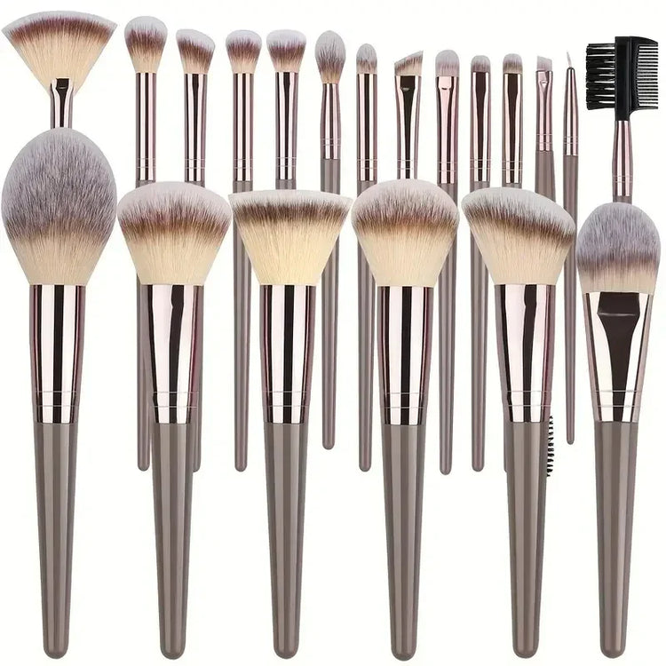 Set of metallic grey makeup brushes with soft synthetic bristles, various shapes and sizes