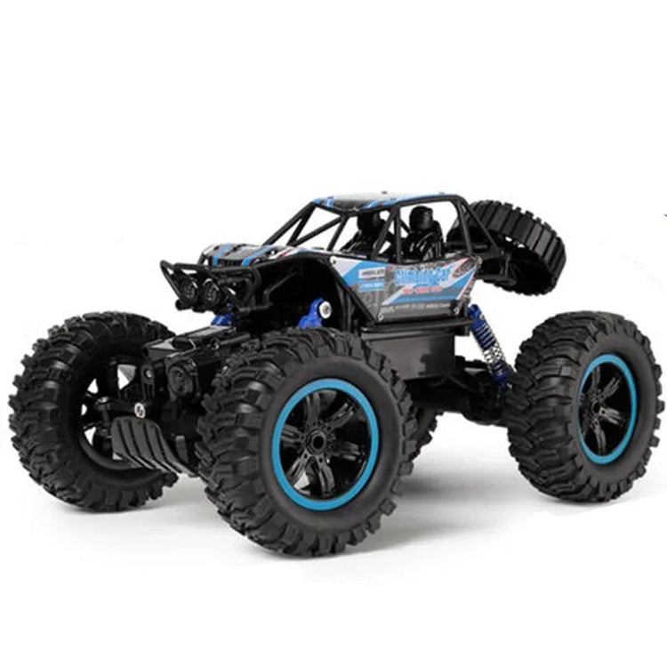 Off-road RC car with oversized black tires, blue accents, rugged frame, and roll cage