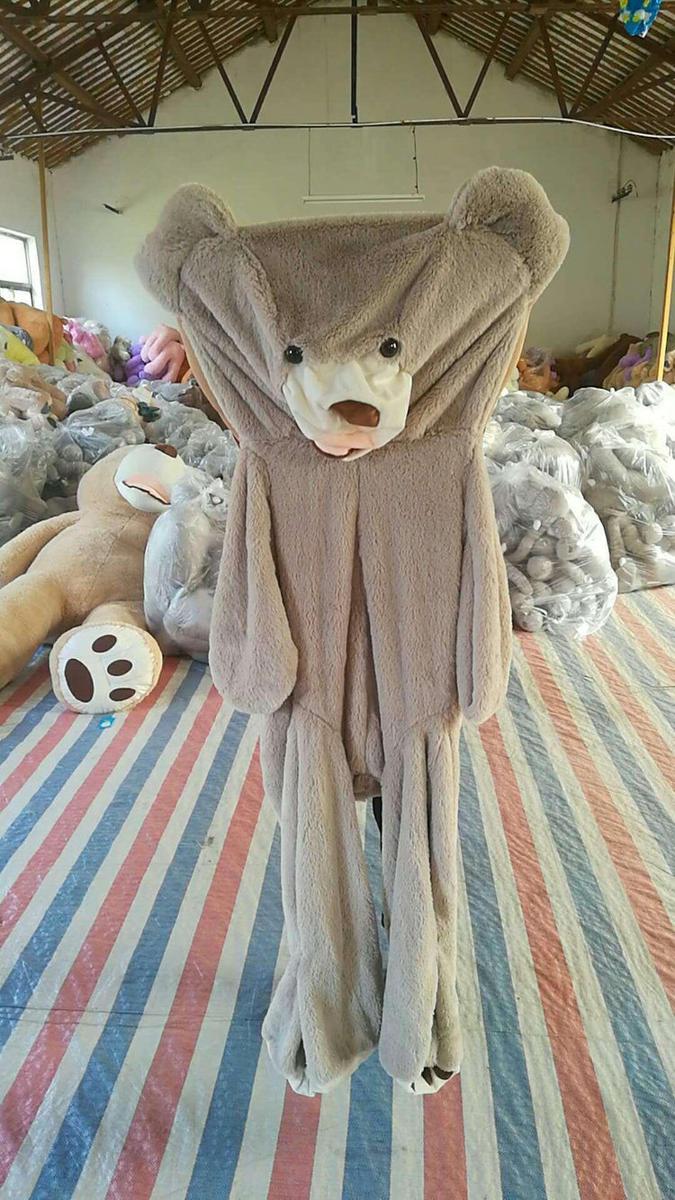 Oversized light brown plush bear costume with loose fit and soft furry material