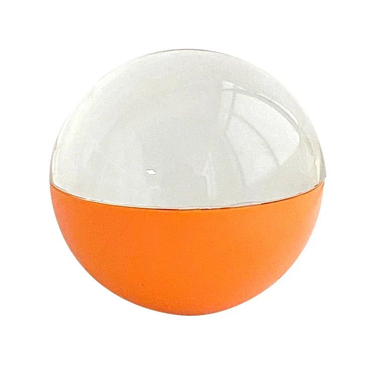 Round capsule toy container with orange base and clear plastic top