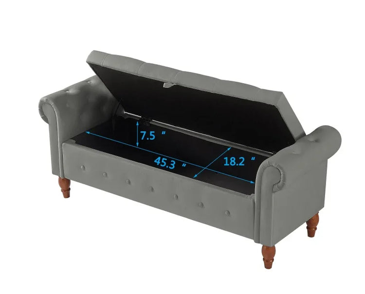 Gray upholstered storage bench with open lid, showing interior dimensions in inches