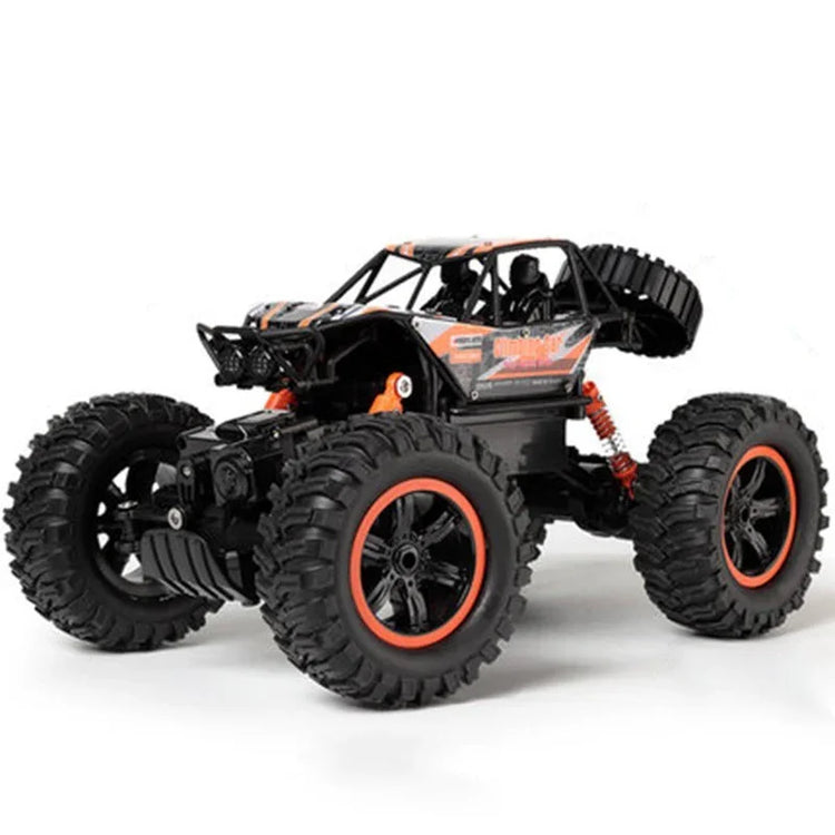 Black and orange off-road remote control car with large rugged tires and roll cage