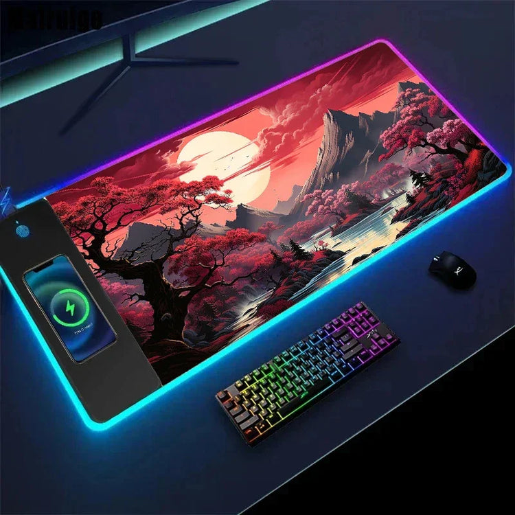 Large RGB gaming mouse pad with vibrant landscape design, wireless phone charger, and mechanical keyboard