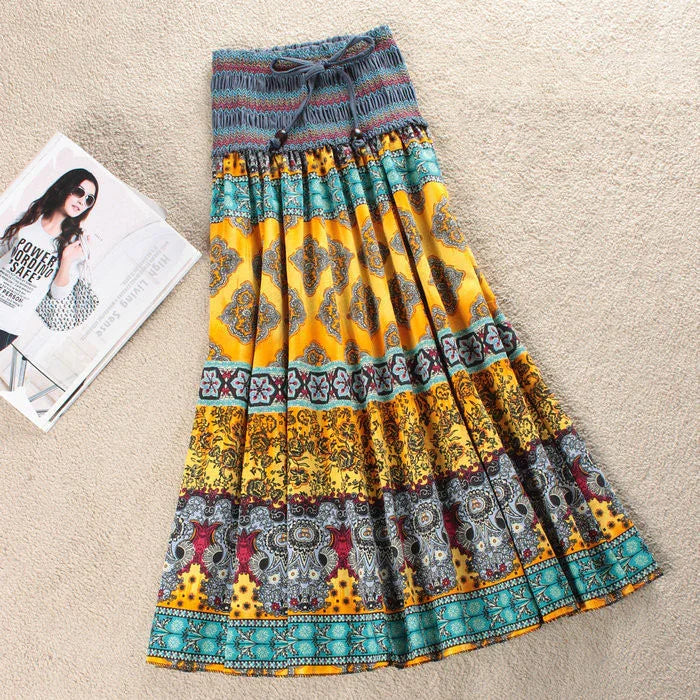Colorful bohemian maxi skirt with yellow, teal, and red patterns, flowy cotton fit