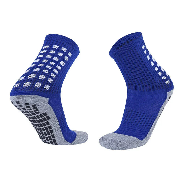 Blue and grey athletic crew socks with ribbed fabric and anti-slip grip soles
