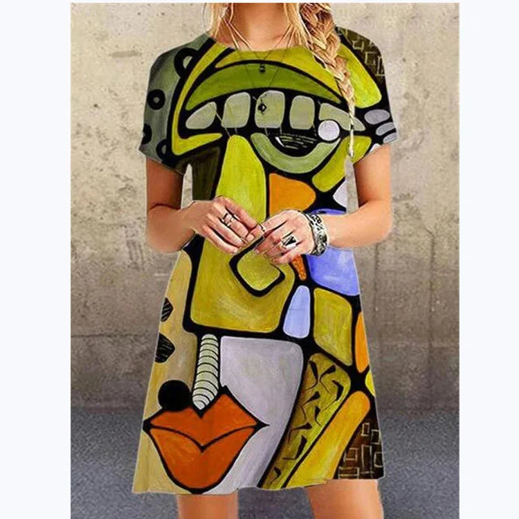 Woman wearing a loose-fit, short-sleeve dress with bold abstract geometric print in green, yellow, orange, and black.