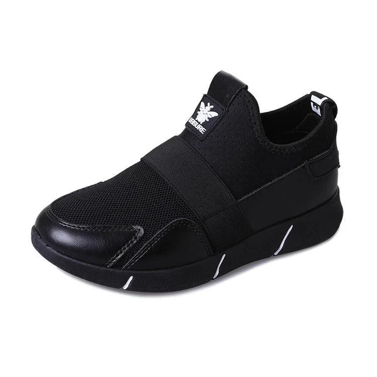 Black slip-on streetwear sneaker with mesh and leather, elastic strap, relaxed fit