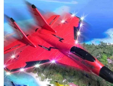 Red futuristic toy jet airplane with LED lights, flying over a tropical beach landscape