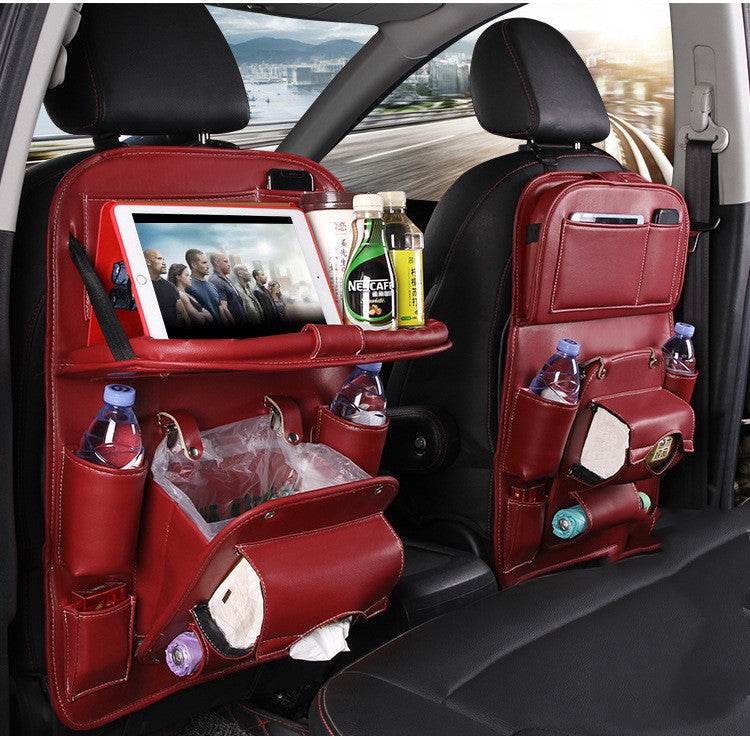 Red PU leather car storage bag with multiple pockets and built-in trash can hanging on car seat backrest