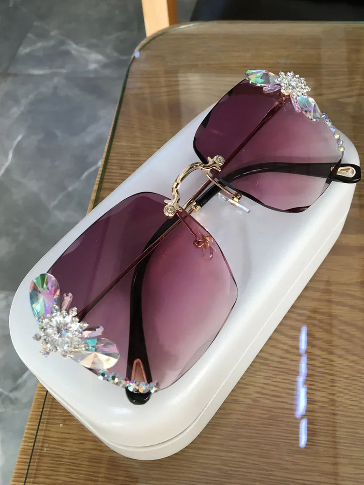 Oversized square sunglasses with purple gradient lenses and crystal floral embellishments