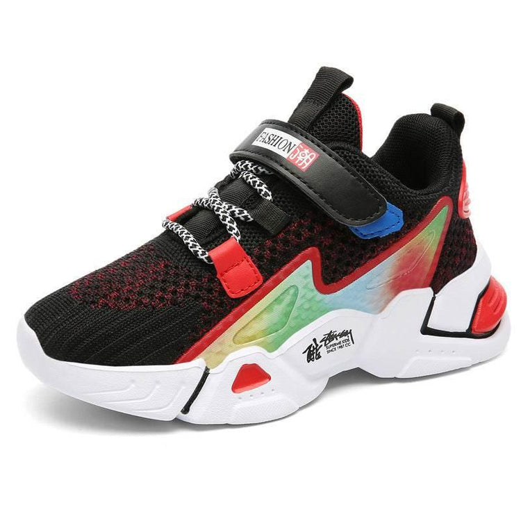 Colorful chunky sneaker with black mesh upper, red accents, rainbow side panel, and white sole