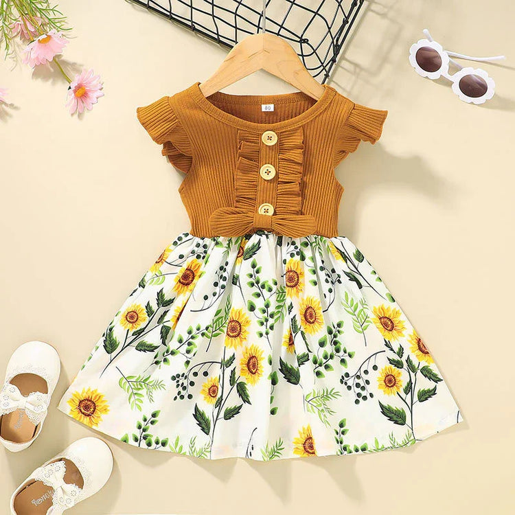 Toddler dress with ribbed mustard yellow top, ruffle sleeves, and sunflower floral skirt