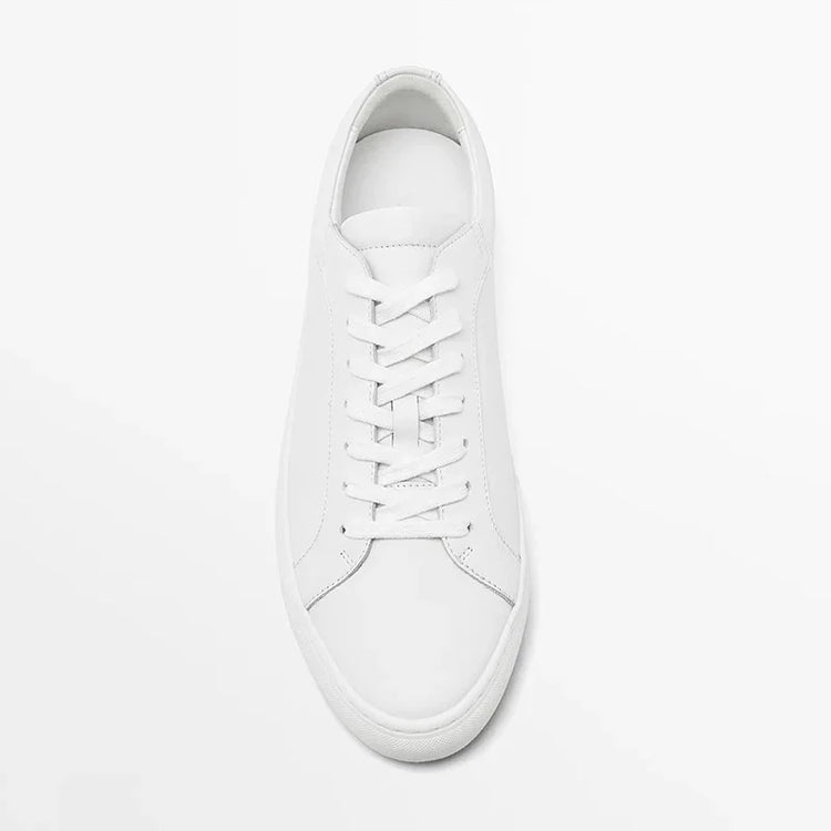Minimalist white leather sneaker with lace-up design and low-top fit on white background