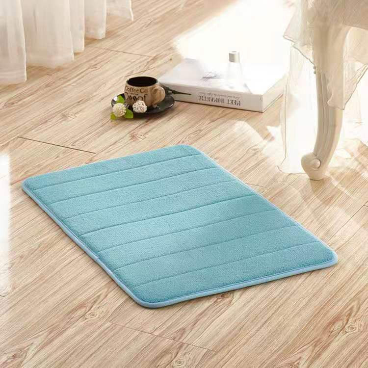Light blue rectangular microfiber rug with a plush, soft texture on wooden floor