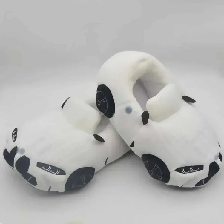 Plush white slippers shaped like cars, soft material, closed-toe, cozy fit.