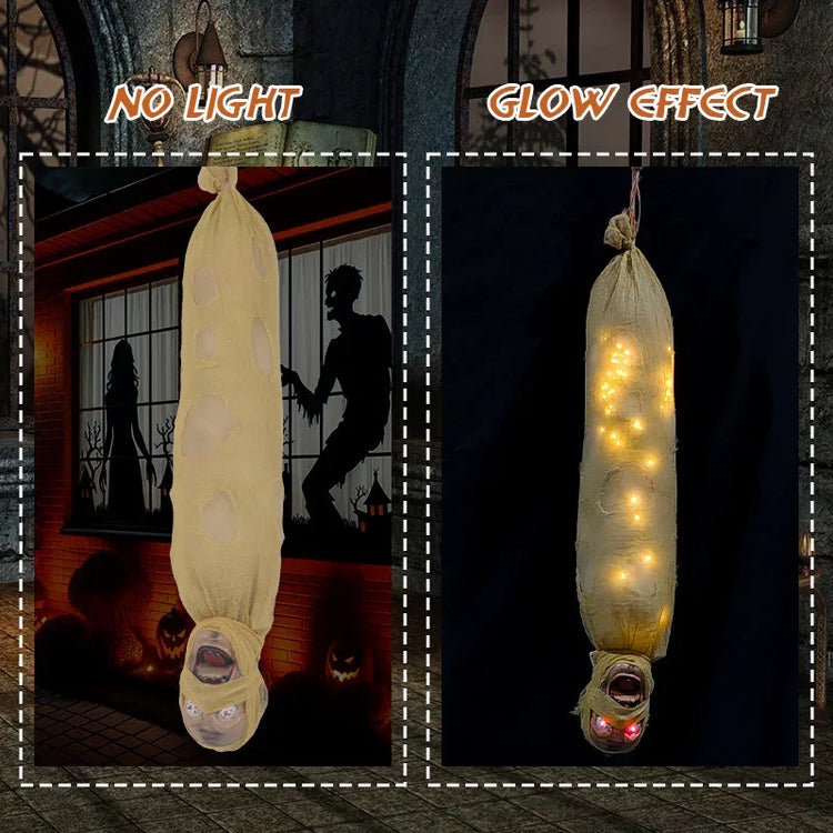 Halloween hanging prop with beige fabric, glowing lights, creepy face, and torn details
