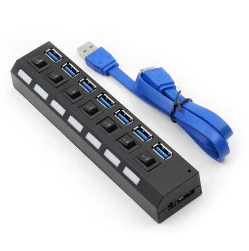Black USB hub with seven USB 3.0 ports, individual power switches, and included blue USB cable