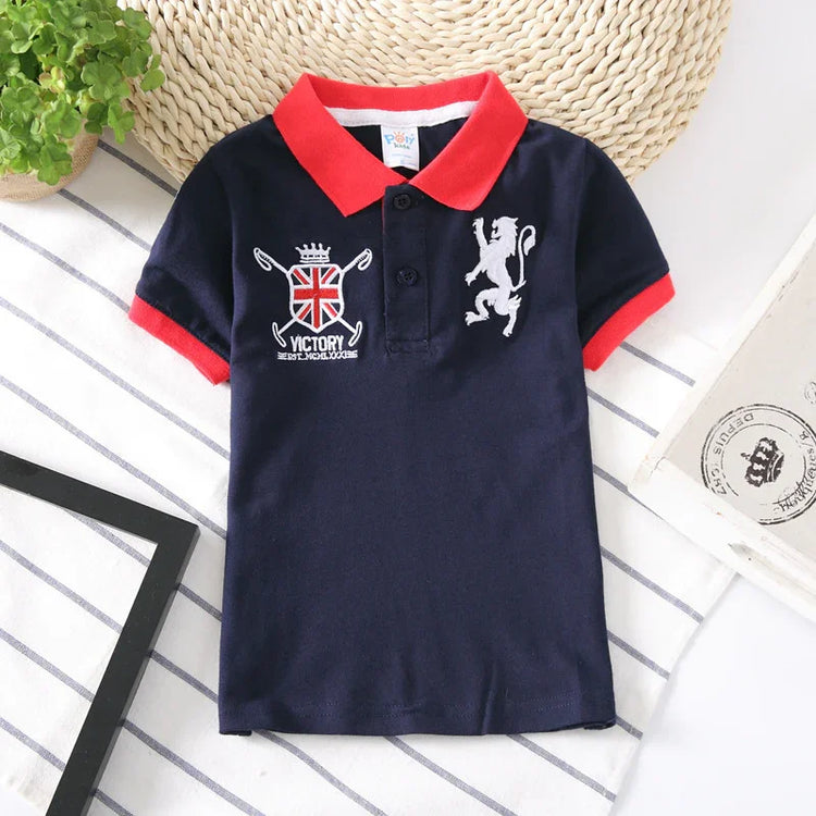 Navy blue short sleeve polo shirt with red collar, red sleeve cuffs, crest and lion embroidery, cotton material, regular fit.