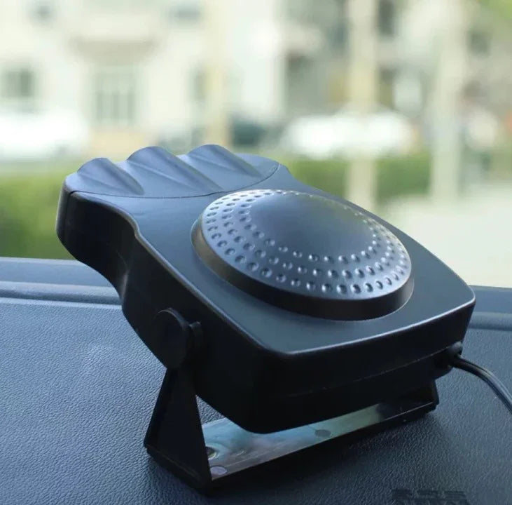 Black portable car heater and defroster with vented design on dashboard