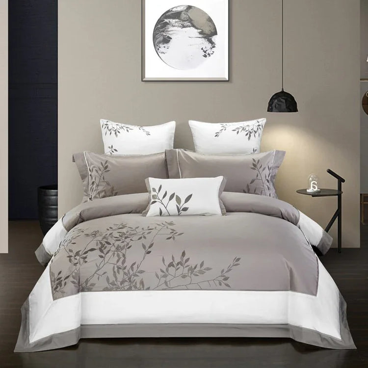 Modern grey and white bedding set with leaf print, soft fabric, elegant minimalist design