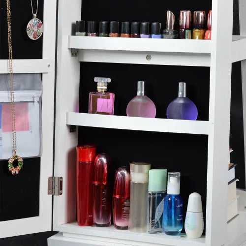 Close-up of white storage cabinet with nail polish, perfume bottles, and skincare products organized on shelves