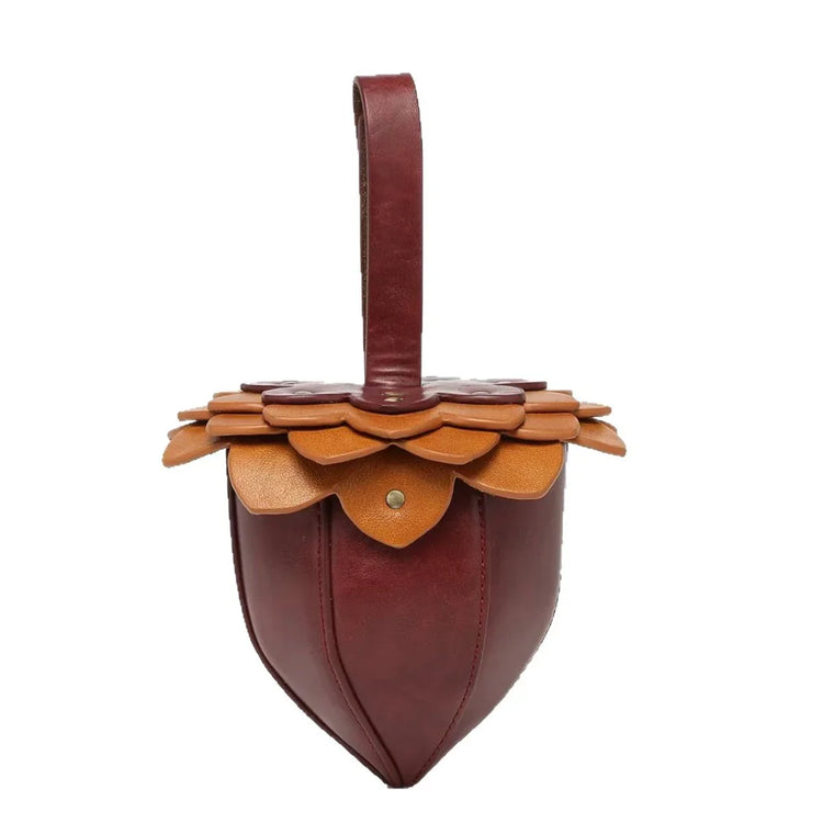 Stylish maroon and tan leather bag with floral layered design and a single top handle