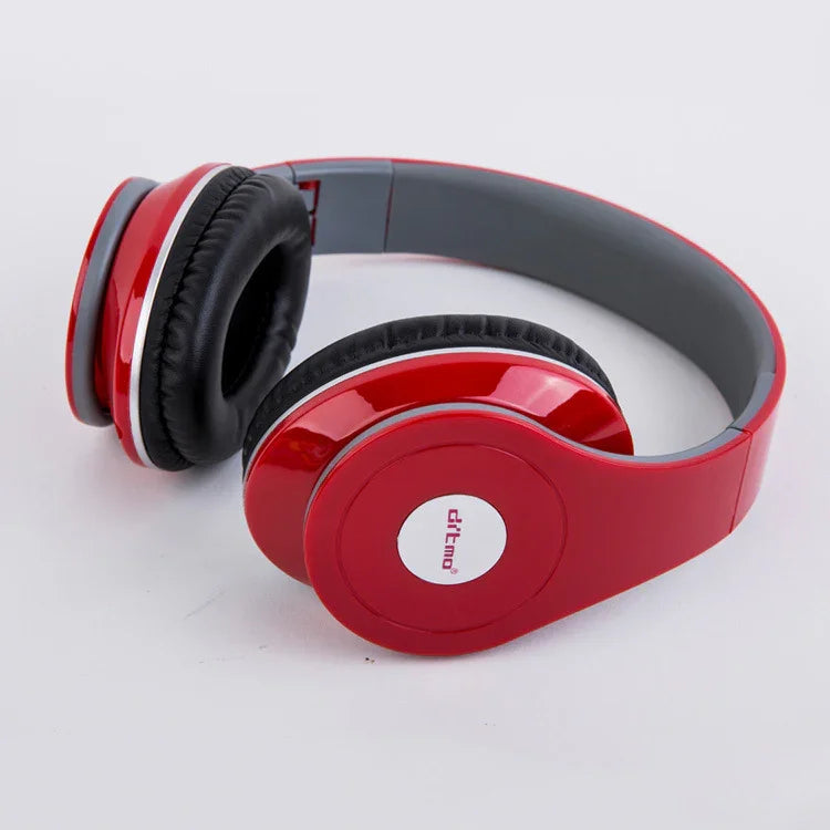 Red over-ear headphones with black cushioned pads and glossy plastic finish
