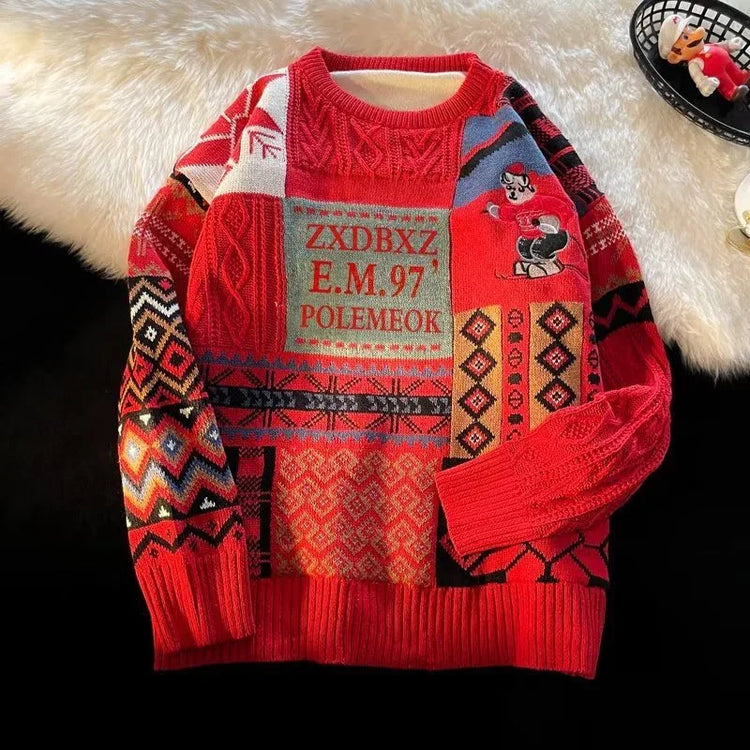Colorful knitted sweater with red base, patchwork patterns, and bold geometric designs