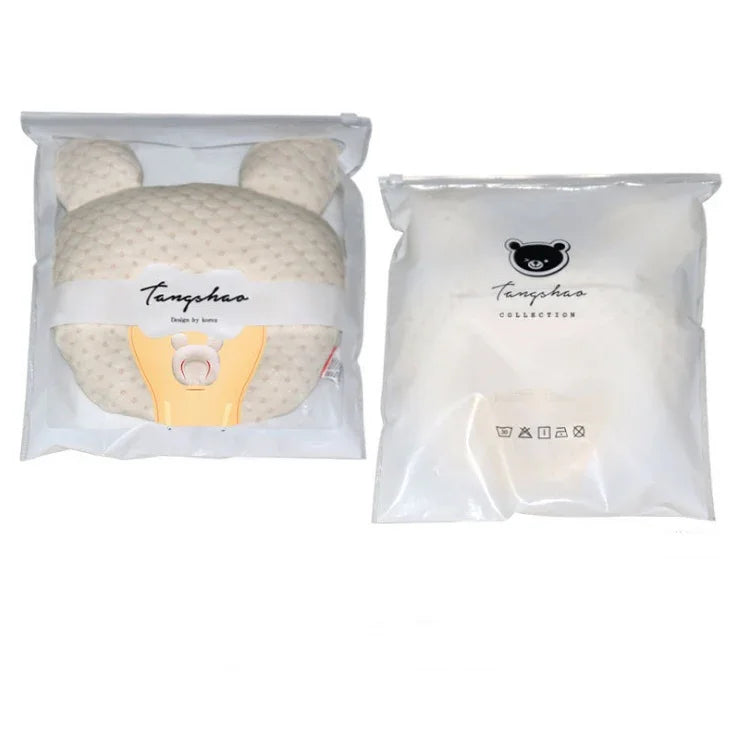 Cream textured bear-shaped pillow with packaging, soft plush material, cozy fit.