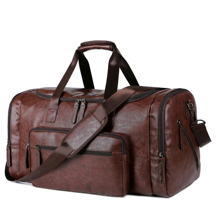 Brown faux leather duffel bag with multiple zippered pockets and adjustable shoulder strap