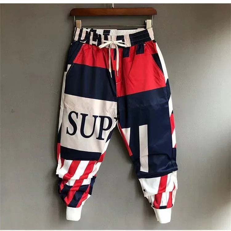 Colorblock streetwear jogger pants with red, navy, and white, elastic waist and relaxed fit