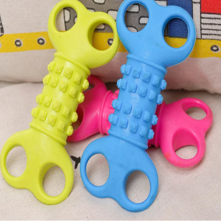 Assorted blue, yellow, and pink textured rubber toys with circular grip handles
