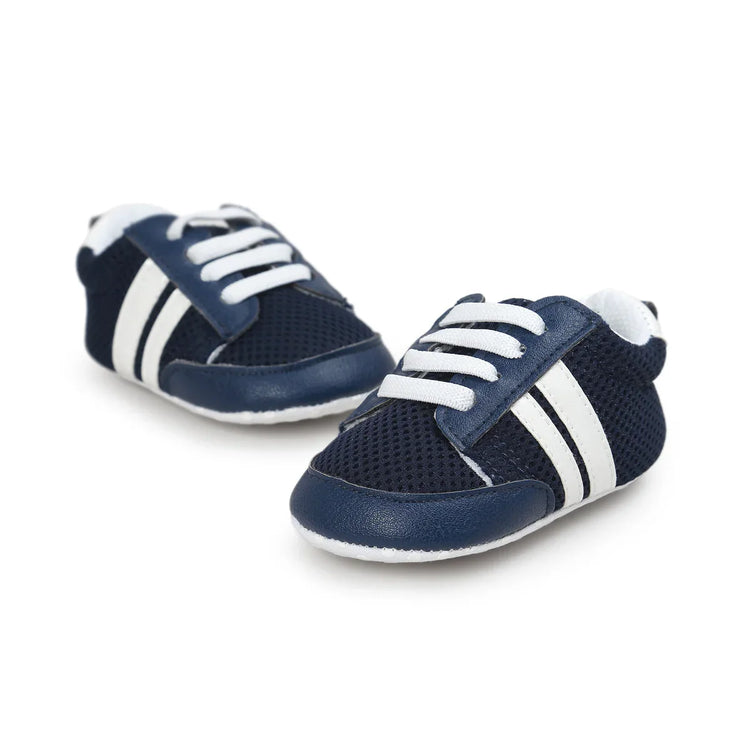 Navy blue mesh baby sneakers with white stripes, faux leather accents, and lace-up design.