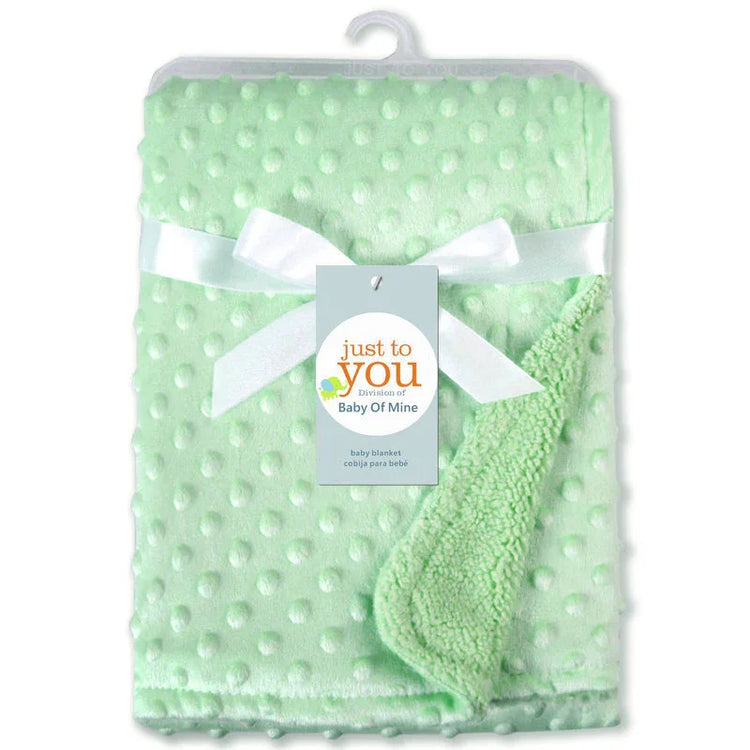 Light green textured fleece baby blanket with white bow and soft plush material