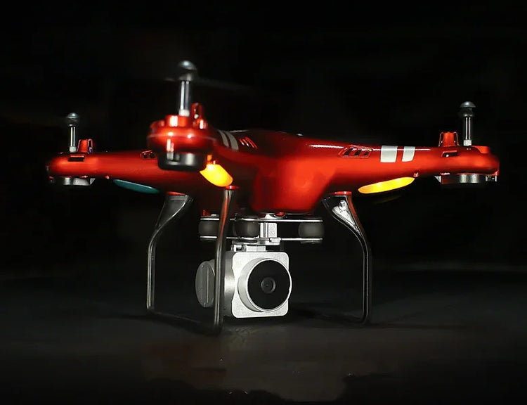Red quadcopter drone with camera, glossy finish, LED lights, and sturdy landing legs