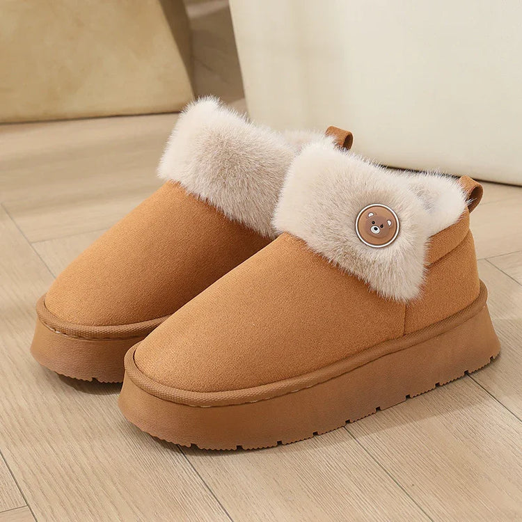 Cozy tan suede winter slippers with plush faux fur lining and chunky sole, bear button detail