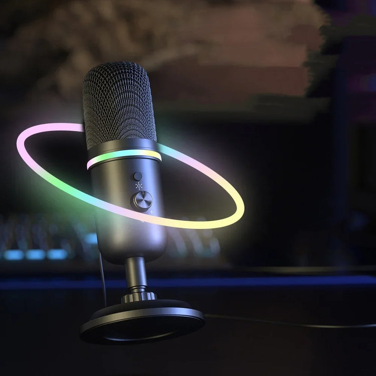 Matte black desktop microphone with mesh grille and multicolor LED ring accent, modern tech look